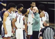  ?? David Butler II / Associated Press ?? UConn coach Dan Hurley talks to his team during a break against Seton Hall during the first half Saturday.