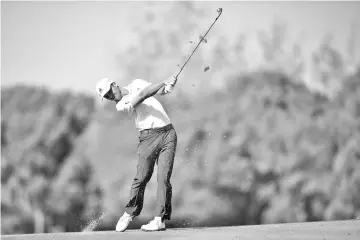  ?? - AFP photo ?? Xander Schauffele of the US hits a shot during the final round of the WGC-HSBC Champions golf tournament in Shanghai on October 28, 2018.