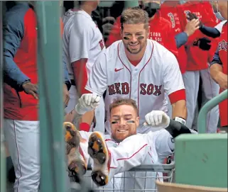  ?? MATT STONE / BOSTON HERALD ?? Kevin Plawecki pushes Christian Vazquez in a cart after Vazquez hit a two-run homer during the fourth inning against the Rays on Wednesday.