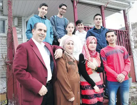  ?? NICK BRANCACCIO ?? Muftakher Al Hayik, front left, Lina Alnatour, Shahed Alhaik, Kamal Alamour and, back left to right, Omar, Mohamad, Waed, Osama and Abdul Alhaik are among the hundreds of Syrian refugees who are settling into their new lives in the Windsor area.