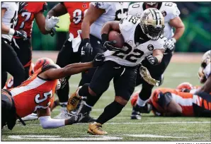  ?? AP/GARY LANDERS ?? New Orleans Saints running back Mark Ingram (22) rushed for 104 yards and caught a 28-yard touchdown pass from Drew Brees in the Saints’ 51-14 victory over the Cincinnati Bengals on Sunday.