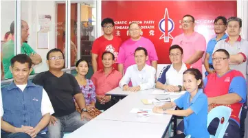  ??  ?? The new elected committee of DAP Sungai Kapit branch in a photo call. Teng (seated at fifth left) is flanked by Ling (fourth left) and Epit.
