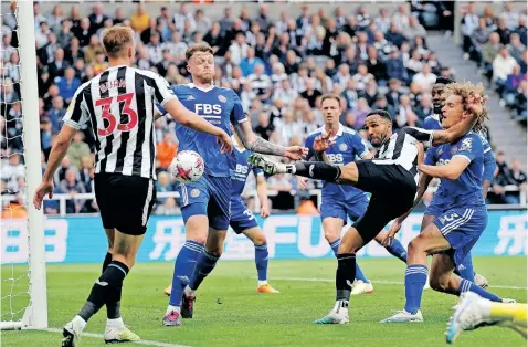 ?? | BackpagePi­x ?? NEWCASTLE’S Callum Wilson sees his shot hit the post during the Premier League match against Leicester at St James’ Park, Newcastle upon Tyne, on Monday.