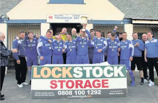  ??  ?? Trearddur Bay celebrate winning the Welsh Alliance Division One Championsh­ip