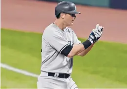  ?? DAVID DERMER/AP ?? Yankees’ DJ LeMahieu celebrates after hitting a single in Game 1 of an American League wildcard baseball series against Cleveland on Tuesday.