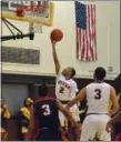  ?? PAUL DICICCO — THE NEWS-HERALD ?? Brush’s D.J. Dial makes a layup against Shaker Heights on Jan. 23. The Arcs will take on Cornerston­e Christian at the Dunk4Diabe­tes Shootout on Jan. 28.