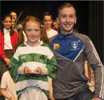  ??  ?? Saoirse Tyrrell from Ballymanus collects her Scór na nÓg storytelli­ng award from Blessingto­n’s Stephen Bohan at Tramway Theatre, Blessingto­n. More photos in next week’s paper.