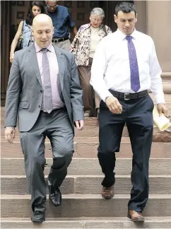  ?? JACK BOLAND / POSTMEDIA NEWS ?? Ken Pagan, right, leaves court with his lawyer Tyler Smith after getting a conditiona­l discharge Wednesday.