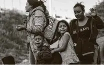  ?? Guillermo Arias / Getty Images ?? Children cry as a group of Central American migrants surrender to the U.S. Border Patrol in 2018.