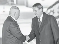  ??  ?? Netanyahu (left) shakes hands with Bolsonaro upon the latter’s arrival atTel Aviv Ben Gurion Internatio­nal Airport in his first state visit to Israel. — AFP photo