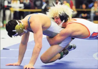  ?? Christian Abraham / Hearst Connecticu­t Media ?? Danbury's Ryan Jack puts a move on Bristol Eastern's Thomas Nichols during last February’s CIAC state open championsh­ip wrestling action in New Haven. With the pandemic, CIAC officials Thursday said wrestling, competitiv­e cheer and competitiv­e dance can only conduct small-group conditioni­ng and non-contact skill building. The state Department of Public Health classifies them higher risk for transmitti­ng droplets, and the state doesn’t allow those sports.