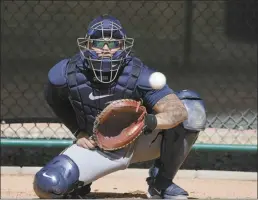  ?? AP photo ?? Milwaukee Brewers catcher William Contreras catches during a spring training baseball workout on Feb. 16.