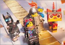  ?? Warner Bros. Pictures ?? BATMAN, left, Wyldstyle, Metalbeard, Benny, Unikitty in “The Lego Movie 2.”