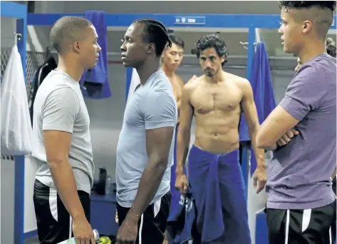  ?? BERTRAND CALMEAU/THE CANADIAN PRESS ?? Karl Walcott, left to right, Emmanuel Kabongo, Jonathan Kim, Andres Joseph and Benjamin Roy are seen in a scene from 21 Thunder.