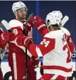  ?? ASSOCIATED PRESS FILE PHOTO ?? Detroit Red Wings’ Anthony Mantha, left, celebrates his goal against the Tampa Bay Lightning with Jon Merrill on Feb. 3. Both players have since been traded.