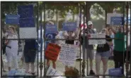  ?? ALEX BRANDON — THE ASSOCIATED PRESS ?? Supporters of Sen. Bernie Sanders, I-Vt., yell at delegates through the fence at Franklin Delano Roosevelt Park in Philadelph­ia, Tuesday.