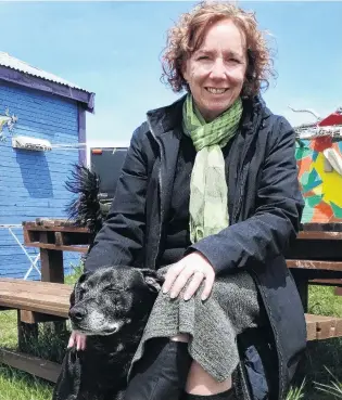  ?? PHOTO: MARK PRICE ?? Quiet moment . . . Chairwoman of the Lake Hawea Community Associatio­n Cherilyn Walthew with Rex.