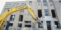  ?? CLIFFORD SKARSTEDT EXAMINER ?? Demolition work continues at the former United Canadian Malt building after city council voted against a heritage designatio­n.