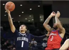  ?? NAM Y. HUH — THE ASSOCIATED PRESS ?? Villanova guard Jahvon Quinerly, left, drives to the basket against DePaul guard Devin Gage Wednesday. The Wildcats won, 86-74.