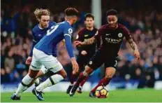  ?? Reuters ?? Manchester City’s Raheem Sterling in action against Everton’s Tom Davies and Mason Holgate.