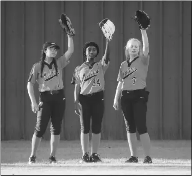  ?? Photo by Alexis Meeks ?? Malvern outfielder­s Aeila Saling (1), Chasney Cooper (24), and Hannah Carey (7) get ready to play defense during a recent game.