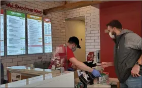  ?? CRYSTAL BEAULIEU — THE NEWS-HERALD ?? Keith Bales is one of the first in line at the grand opening of Smoothie King on Mentor Avenue.