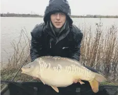  ??  ?? Lewis Bellamy with his 25lb 10oz carp.