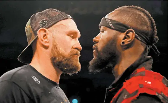  ?? FOTOS: REUTERS ?? Terminando la pelea de Tyson Fury (i), Deontay Wilder subió al ring para encararlo y aceptar su reto