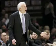  ?? AP PHOTO/TONY DEJAK ?? San Antonio Spurs head coach Gregg Popovich yells instructio­ns to players in the first half of Sunday’s game against the Cleveland Cavaliers in Cleveland.