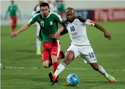  ?? Photo by Ryan Lim ?? Al Wahda’s Ismail Matar is challenged for the ball by Al Wehdat’s Omar Azmi Faek Quandeel during their AFC Champions League playoff match held at Al Nahyan Stadium in Abu Dhabi late on Tuesday. —