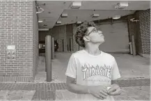  ?? Godofredo A. Vasquez / Houston Chronicle ?? Andre Medina, 17, waits to be picked up Wednesday after being released from the Harris County Jail on personal bond.