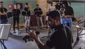  ?? Ramon Espinosa / Associated Press ?? Flutist Ethiel Failde conducts a rehearsal of danzon with the Failde Orchestra in Matanzas, Cuba, on Oct. 2.