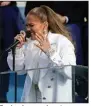  ?? (AP/Andrew Harnik) ?? For her inaugural performanc­e, Jennifer Lopez sings a medley of “This Land Is Your Land” and “America the Beautiful,” with a short, peppy refrain in Spanish.