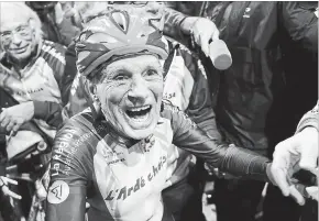  ?? THIBAULT CAMUS THE ASSOCIATED PRESS ?? French cyclist Robert Marchand, 106 years old, is the oldest person to cycle around France’s national velodrome.