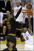  ?? ERIC RISBERG — THE ASSOCIATED PRESS ?? LeBron James blocks a shot by Andre Iguodala late in Game 7 of the 2016NBA Finals.