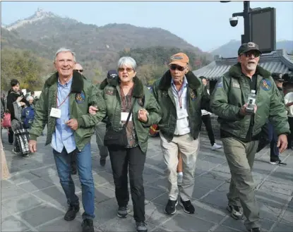  ?? REN CHAO / XINHUA ?? Flying Tigers veteran Harry Moyer (second from right) visits the Badaling section of the Great Wall in Beijing on Oct 29, 2023. He was part of a delegation from the Sino-American Aviation Heritage Foundation. The foundation has long been involved in promoting the Flying Tigers’ story in both China and the United States.