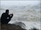  ??  ?? SURF’S UP: An enthralled lensman captures the churning waves in Camps Bay which accompanie­d the wild weather that hit Cape shores.