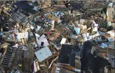  ?? FERNANDO LLANO — THE ASSOCIATED PRESS ?? Homes lay in ruins Monday, one week after Hurricane Dorian hit The Mudd neighborho­od in Abaco, Bahamas. Dorian has killed at least 44people in the Bahamas as of Sunday, Sept. 8, according to the government.