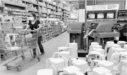  ?? AMY BETH BENNETT/AP ?? Home Depot aisles are stocked with hurricane supplies on Friday in Boynton Beach. The forecast calls for Hurricane Isaias to stay east of the Florida coast.