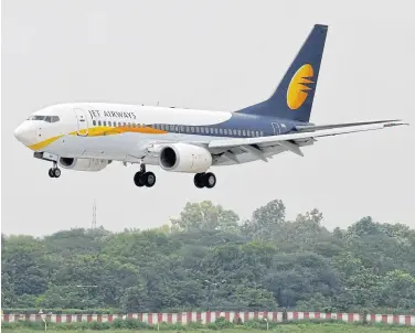  ?? REUTERS ?? A Jet Airways passenger aircraft prepares to land at the airport in the western Indian city of Ahmedabad in this file photo.