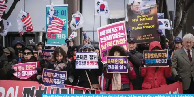  ??  ?? SEOUL: Anti-North Korea activists stage a demonstrat­ion against the inter-Korean talks, in Seoul yesterday. North Korea said it was willing to send athletes and a high-level delegation to the forthcomin­g Winter Olympics in the South as the rivals held...