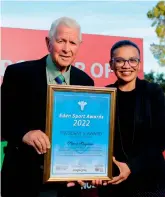  ?? ?? Simon Swigelaar receives the Eden Sport Council Presidenti­al Award from Advocate Michelle Weyers - a member of the board of directors of SWD Cricket.