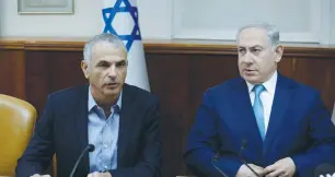  ?? (Amir Cohen/Reuters) ?? PRIME MINISTER Benjamin Netanyahu and Finance Minister Moshe Kahlon at a cabinet meeting. Kahlon said over the weekend that a ‘coalition of 61 is impossible.’