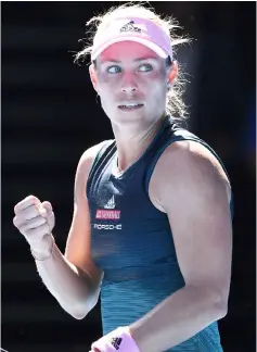  ??  ?? Kerber celebrates her victory against Hercog during their women’s singles match on day one of the Australian Open tennis tournament in Melbourne. — AFP photo