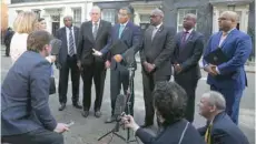  ?? —- AFP ?? Jamaica’s Prime Minister Andrew Holmes (C) and leaders of Caribbean countries speak to the media outside 10 Downing Street on Tuesday.