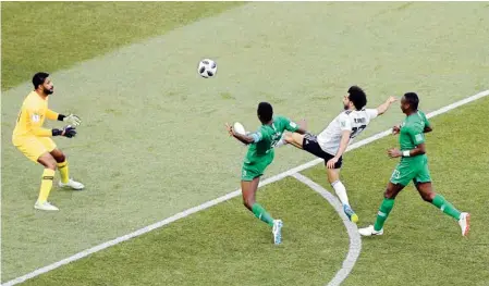  ?? PIC/PTI ?? Egypt's Mohamed Salah scores the opening goal during the group A match between Saudi Arabia and Egypt at the 2018 football World Cup in Volgograd, Russia on Monday