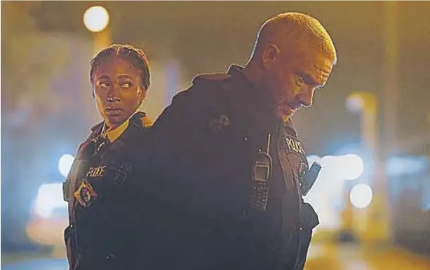  ?? ?? Rachel (Adelayo Adedayo) and Chris (Martin Freeman) are the thin blue line on the streets of Liverpool in The Responder. Photo: Dancing Ledge/ Rekha Garton / BBC