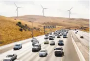  ?? Brittany Hosea-Small / Special to the Chronicle ?? Drivers creep in traffic on I-580 at the Altamont Pass. A new train connection may ease the pain.