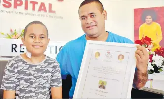  ?? Picture: SOPHIE RALULU ?? Michael Tafunai (right) with his son Kenneth at the Sri Sathya Sai Sanjeevani Children’s Hospital in Suva.