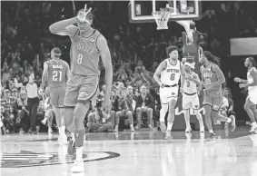  ?? PHOTOS BY NATHAN J. FISH/THE OKLAHOMAN ?? Thunder forward Jalen Williams (8) celebrates a 3-point play in the fourth quarter of a 129-120 win against the Knicks on Wednesday at Paycom Center.